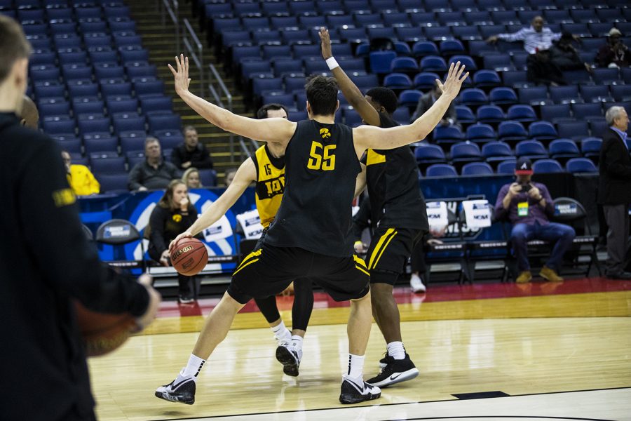 Iowa guards Luka Garza and Isaiah Moss defend Iowa forward Ryan Kriener during the Iowa basketball practice at Nationwide Arena in Columbus, Ohio on Thursday, March 21, 2019. The Hawkeyes will compete against the Cincinnati Bearcats tomorrow in the NCAA Tournament.