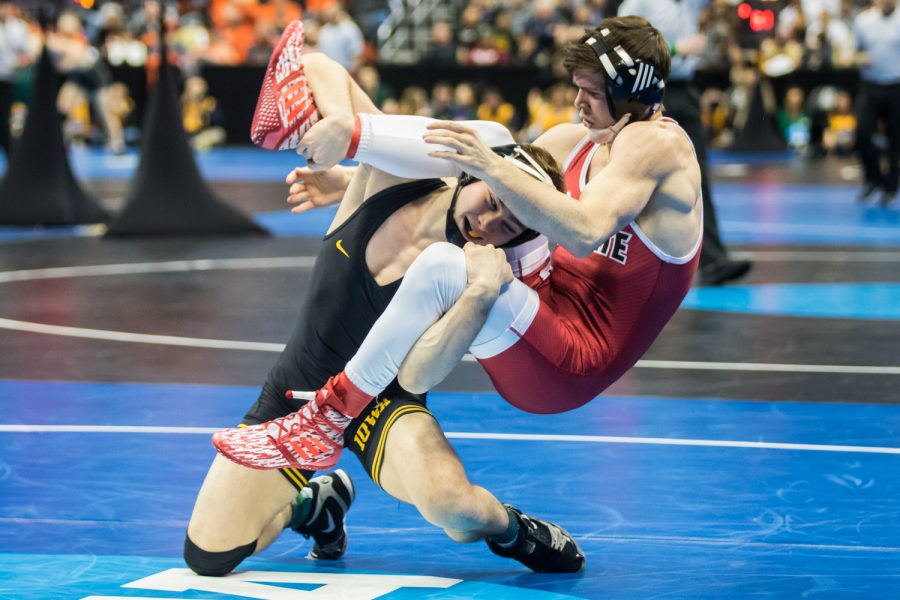 Iowa’s 125-pound Spencer Lee wrestles NC State’s Sean Fausz during the second session of the 2019 NCAA D1 Wrestling Championships at PPG Paints Arena in Pittsburgh, PA on Thursday, March 21, 2019. Lee won by major decision, 10-1.