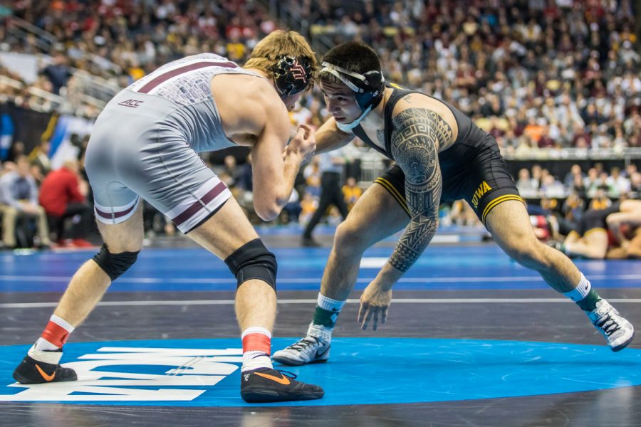 Iowa’s 149-pound Pat Lugo wrestles Virginia Tech’s Ryan Blees during the second session of the 2019 NCAA D1 Wrestling Championships at PPG Paints Arena in Pittsburgh, PA on Thursday, March 21, 2019. Lugo won in the second overtime period by sudden victory, 4-2.