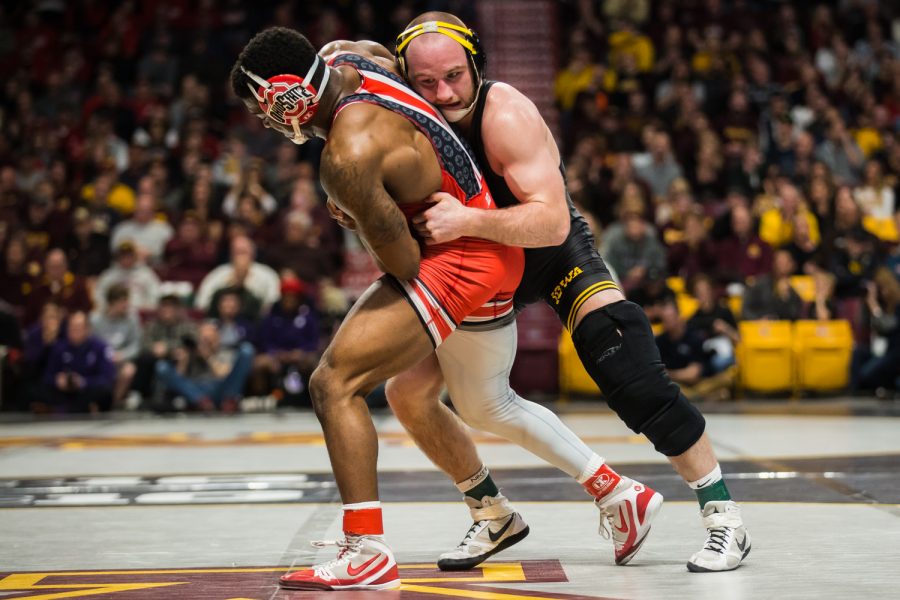 Iowa's 165-lb Alex Marinelli wrestle's Ohio State's Te'Shan Campbell during the first session of the 2019 Big Ten Wrestling Championships in Minneapolis, MN on Saturday, March 9, 2019. Marinelli won by decision, 6-3.