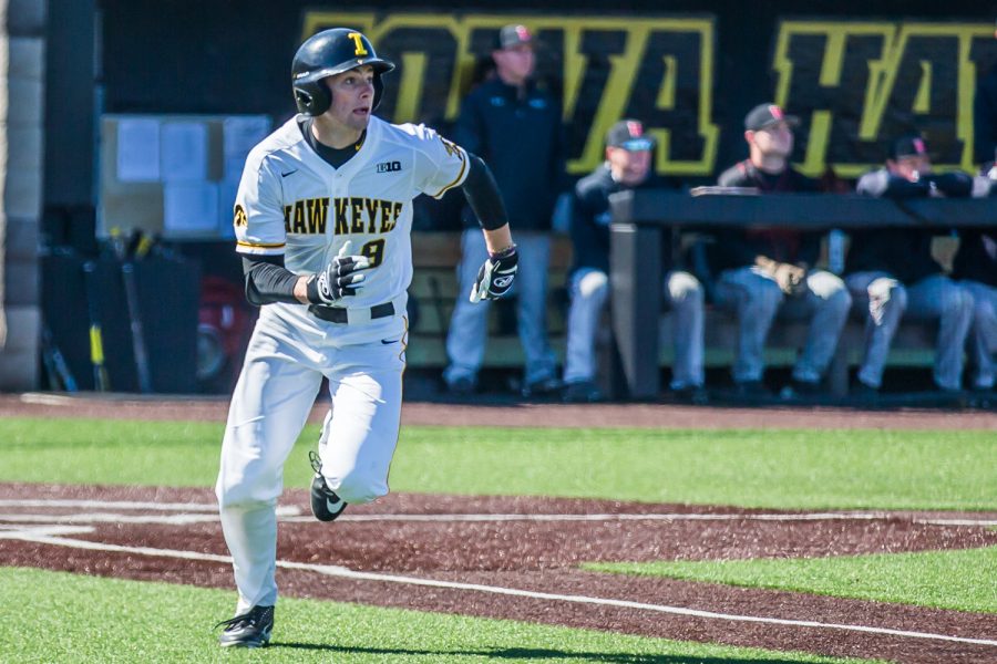Iowa outfielder Ben Norman sprints to first base during a baseball game between Iowa and Cal-State Northridge at Duane Banks Field on Saturday, March 16, 2019. The Hawkeyes dropped their home opener to the Matadors, 8-5.