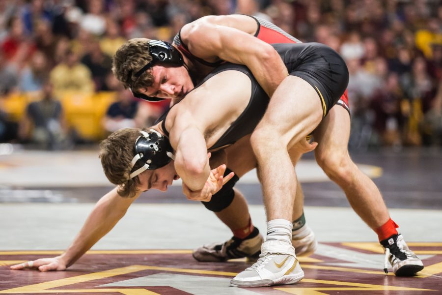 Iowa's 133-lb Austin DeSanto wrestles Rutgers' Nick Suriano during the second session of the 2019 Big Ten Wrestling Championships in Minneapolis, MN on Saturday, March 9, 2019. Suriano won by decision, 6-3.