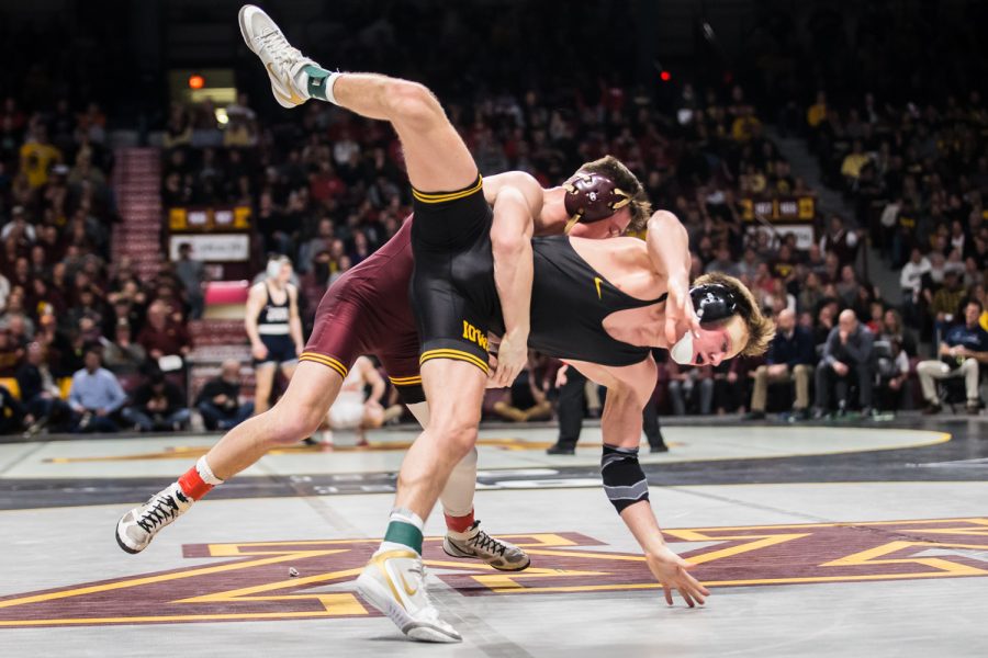 Iowas 141-lb Max Murin wrestles Minnesotas Mitch McKee during the second session of the 2019 Big Ten Wrestling Championships in Minneapolis, MN on Saturday, March 9, 2019. McKee won by decision, 2-1.