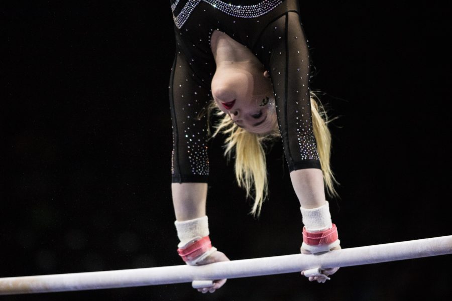 Iowas Charlotte Sullivan competes on uneven bars during a womens gymnastics meet between Iowa and Iowa State at Carver-Hawkeye Arena on Friday, March 1, 2019. Sullivan scored 9.825 in the event. The Hawkeyes, celebrating senior night, fell to the Cyclones, 196.275-196.250. 
