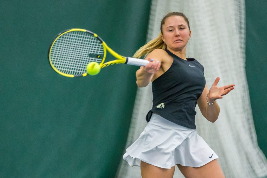 Iowa's Danielle Burich hits a forehand during a women's tennis match between Iowa and Indiana at the HTRC on Sunday, March 31, 2019. The Hawkeyes defeated the Hoosiers, 4-3.