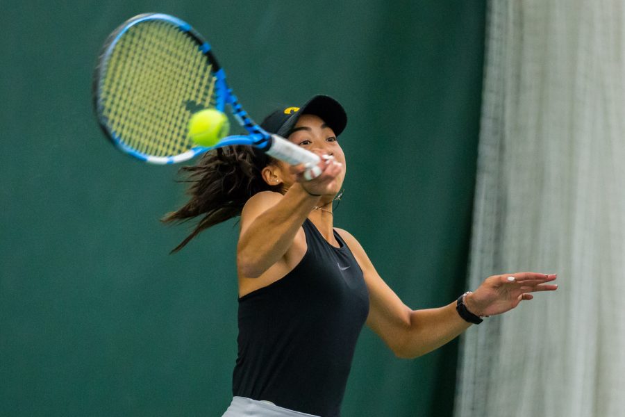 Iowas Michelle Bacalla hits a forehand during a womens tennis match between Iowa and Indiana at the HTRC on Sunday, March 31, 2019. The Hawkeyes defeated the Hoosiers, 4-3.