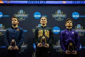 Iowas Spencer Lee holds the first-place trophy for the 125-pound weight class during the final session of the 2019 NCAA D1 Wrestling Championships at PPG Paints Arena in Pittsburgh, PA on Saturday, March 23, 2019.