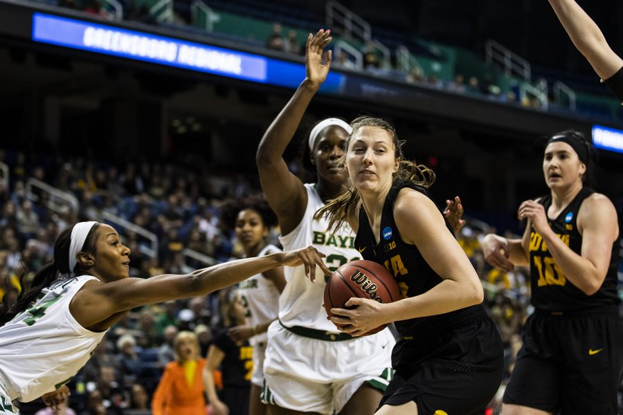 Iowa+forward+Amanda+Ollinger+keeps+the+ball+away+from+Baylor+guard+Chloe+Jackson+during+the+NCAA+Elite+8+game+against+Baylor+at+the+Greensboro+Coliseum+Complex+on+Monday%2C+April+1%2C+2019.+The+Bears+defeated+the+Hawkeyes+85-53.