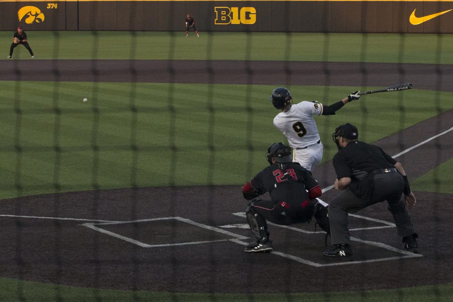 Iowa outfielder Ben Norman hits a grounder at the Iowa vs Rutgers game at Duane Banks Field on Friday, April 4, 2019. Norman struck out twice during the game. The Hawkeyes defeated the Scarlet Knights 6-1.