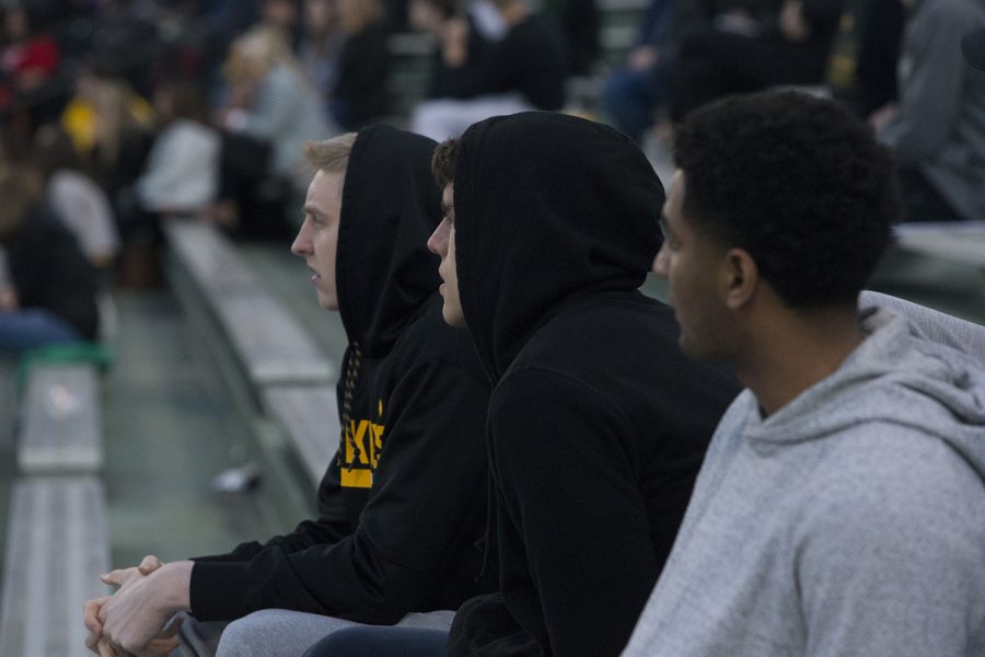 Iowa basketball players watch the Iowa vs Rutgers game at Duane Banks Field on Friday, April 4, 2019. The Hawkeyes defeated the Scarlet Knights 6-1.