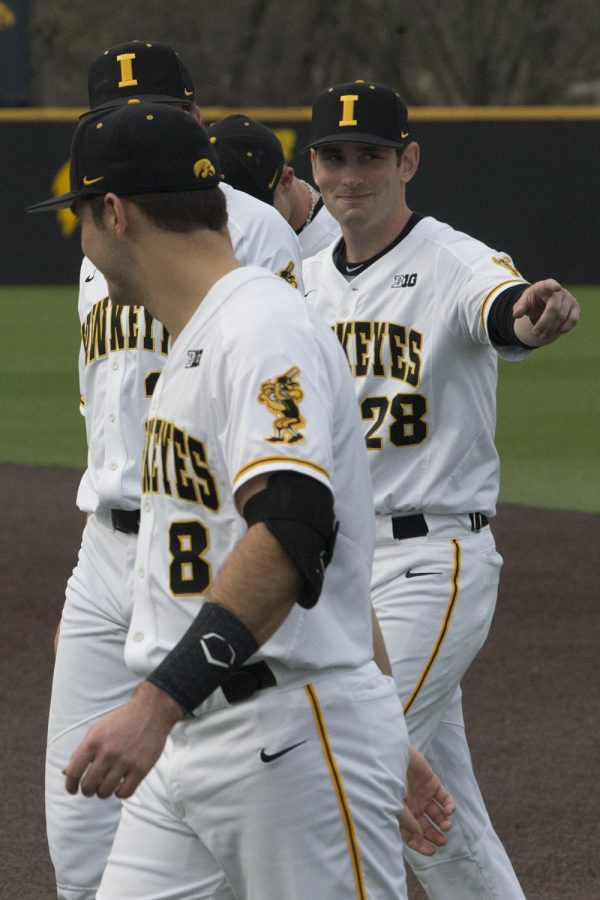 Iowa fielder Chris Whelan points to a spectator before the Iowa vs Rutgers game at Duane Banks Field on Friday, April 4, 2019. Whelan went on to score two runs for the Hawkeyes in the sixth and seventh innings. The Hawkeyes defeated the Scarlet Knights 6-1.