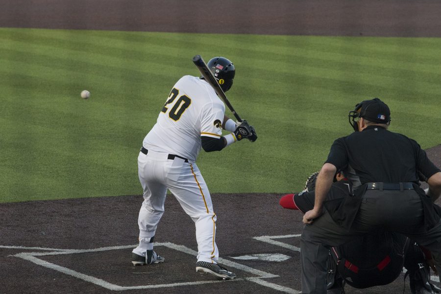 Iowa first baseman Izaya Fullard watches the ball at the Iowa vs Rutgers game at Duane Banks Field on Friday, April 4, 2019. Fullard hit a home run in the sixth inning, scoring the first points of the game. The Hawkeyes defeated the Scarlet Knights 6-1.