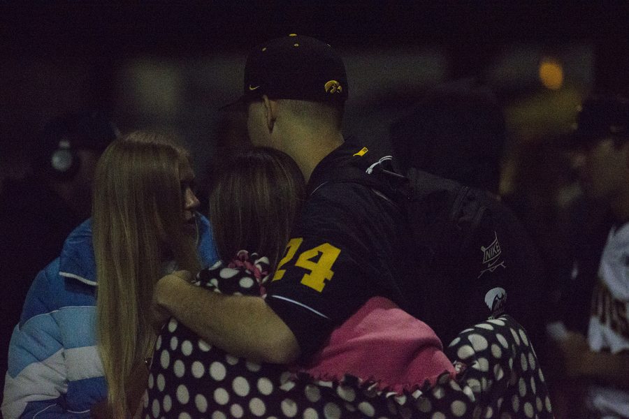 Hawkeye fans and families greet the players after the Iowa vs Rutgers game at Duane Banks Field on Friday, April 4, 2019. The Hawkeyes defeated the Scarlet Knights 6-1.