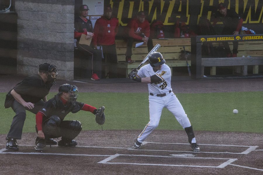 Iowa outfielder Chris Whelan stares down the ball at the Iowa vs Rutgers game at Duane Banks Field on Friday, April 4, 2019. Whelan scored two runs for the Hawkeyes in the sixth and seventh innings. The Hawkeyes defeated the Scarlet Knights 6-1.