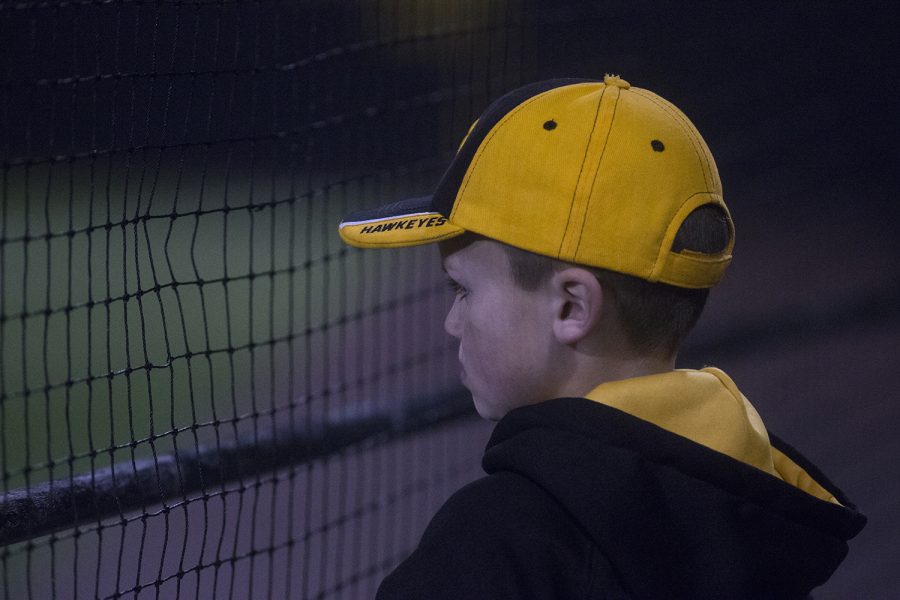 An Iowa fan watches the game at the Iowa vs Rutgers game at Duane Banks Field on Friday, April 4, 2019. The Hawkeyes defeated the Scarlet Knights 6-1.