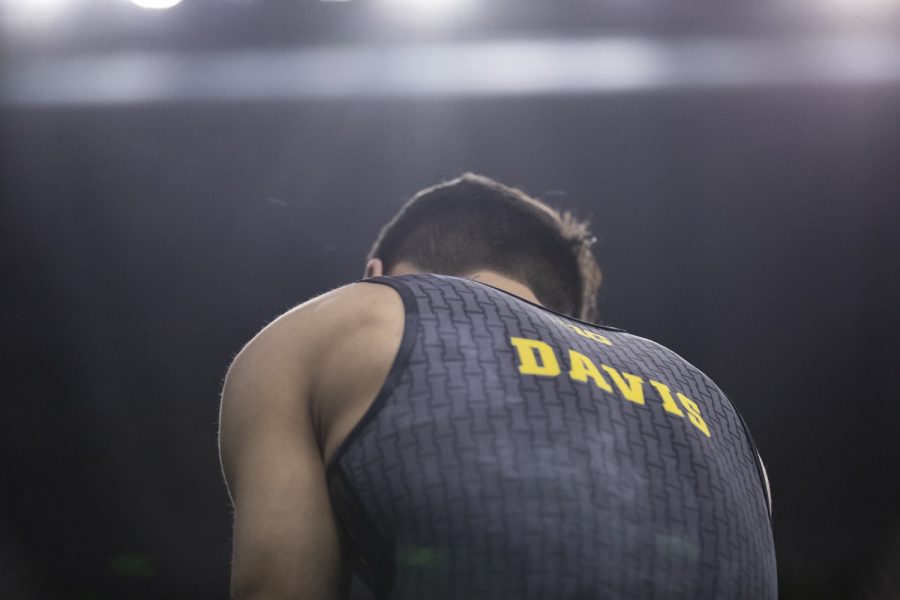 Hawkeye Gymnast Evan Davis prepares to compete in the parallel bars Friday in Carver Hawkeye Arena during the Men's Big Ten Championships. Penn State won the team competition with a combined score of 410.350 points. 