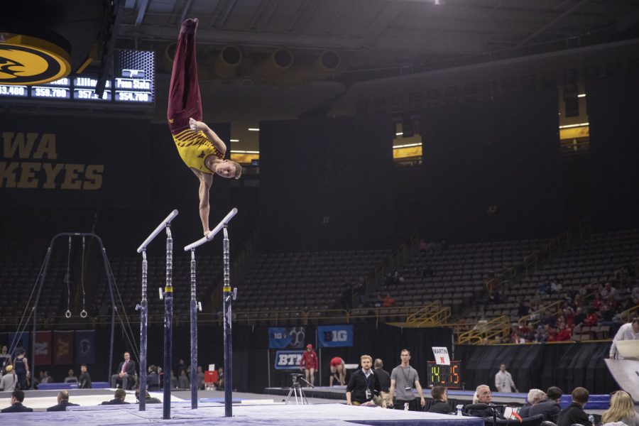 Minnesota gymnast Timmy Kutyla competes in the parallel bars Friday in Carver Hawkeye Arena during the Men's Big Ten Championships. Penn State won the team competition with a combined score of 410.350 points. 