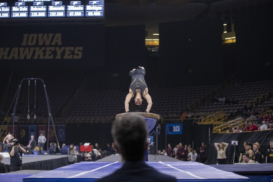 Hawkeye gymnast Addison Chung competes in the vault Friday in Carver Hawkeye Arena during the Men's Big Ten Championships. Penn State won the team competition with a combined score of 410.350 points. 