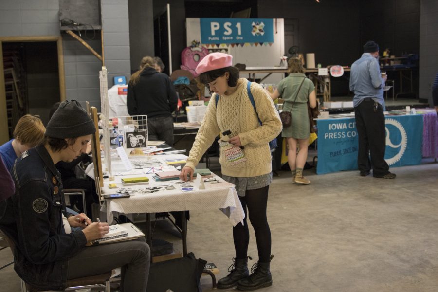 Patrons visit the Ice Cream Comics event in Public Space One on April 6, 2019. ICE CREAM, or Iowa City Expo for Comics and real Eclectic Media, was hosted in as a part of Mission Creek. Local artist sold their cartoons, stickers, shirts, and books.