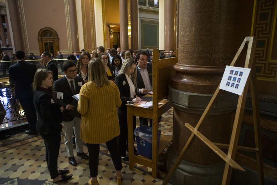 UISG senators gather outside the senate chamber during the Hawkeye Caucus at the Iowa State Capitol in Des Moines on April 9, 2019. The Hawkeye Caucus provides members of the University of Iowa community to come speak with Iowa legislatures. (Katie Goodale/The Daily Iowan)