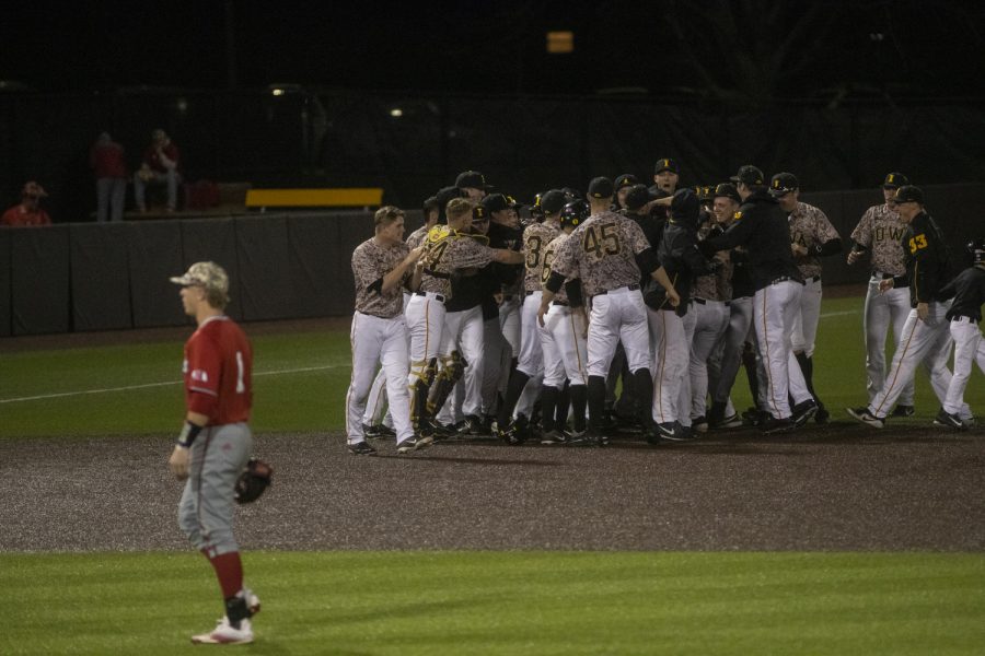 The Hawkeyes celebrate after a baseball game against Nebraska in Duane Banks Field on April 19, 2019. The Hawkeyes defeated the Cornhuskers 3-2.