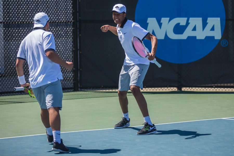 Iowa's Oliver Okonkwo celebrates a point during a men's tennis match between Iowa and Michigan at the HTRC on Sunday, April 21, 2019. The Hawkeyes, celebrating senior day, defeated the Wolverines, 4-1.