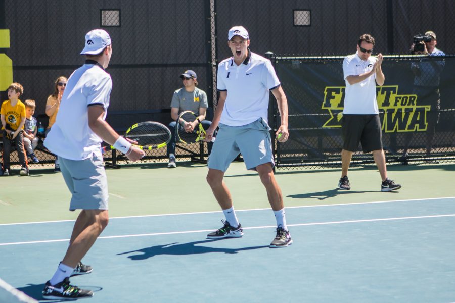 Iowa's Joe Tyler celebrates a point during a men's tennis match between Iowa and Michigan at the HTRC on Sunday, April 21, 2019. The Hawkeyes, celebrating senior day, defeated the Wolverines, 4-1.