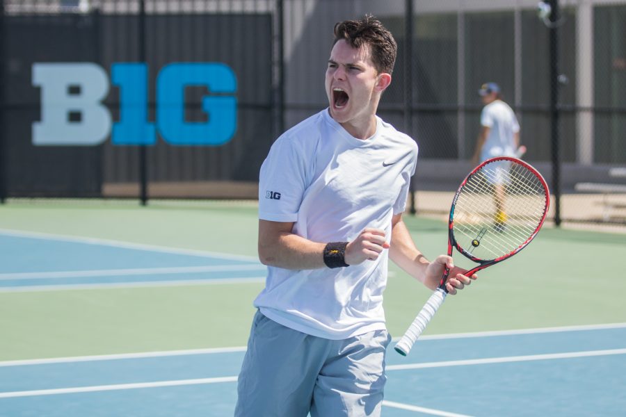 Iowa's Jonas Larsen celebrates a point during a men's tennis match between Iowa and Michigan at the HTRC on Sunday, April 21, 2019. The Hawkeyes, celebrating senior day, defeated the Wolverines, 4-1.