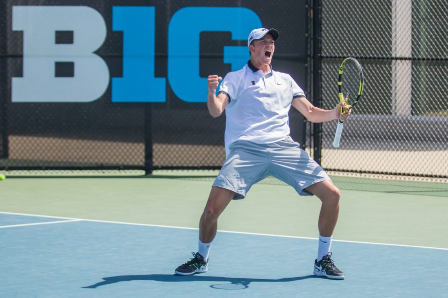 Iowa's Joe Tyler celebrates a point during a men's tennis match between Iowa and Michigan at the HTRC on Sunday, April 21, 2019. The Hawkeyes, celebrating senior day, defeated the Wolverines, 4-1.