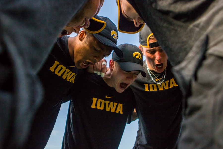 Iowa players huddle before a men's tennis match between Iowa and Illinois State at the HTRC on Sunday, April 21, 2019. The Hawkeyes defeated the Redbirds, 6-1.