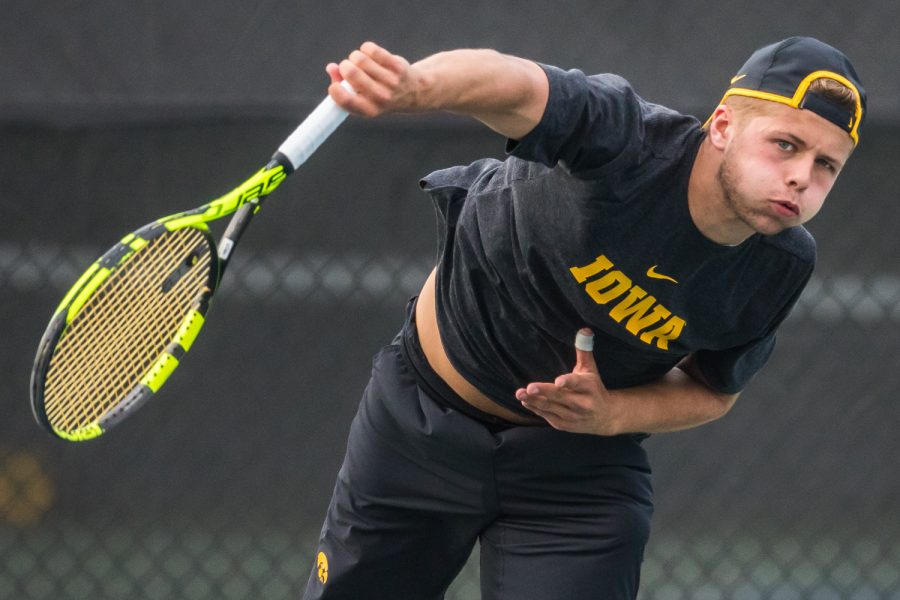 Iowa's Will Davies hits a serve during a men's tennis match between Iowa and Illinois State at the HTRC on Sunday, April 21, 2019. The Hawkeyes defeated the Redbirds, 6-1.