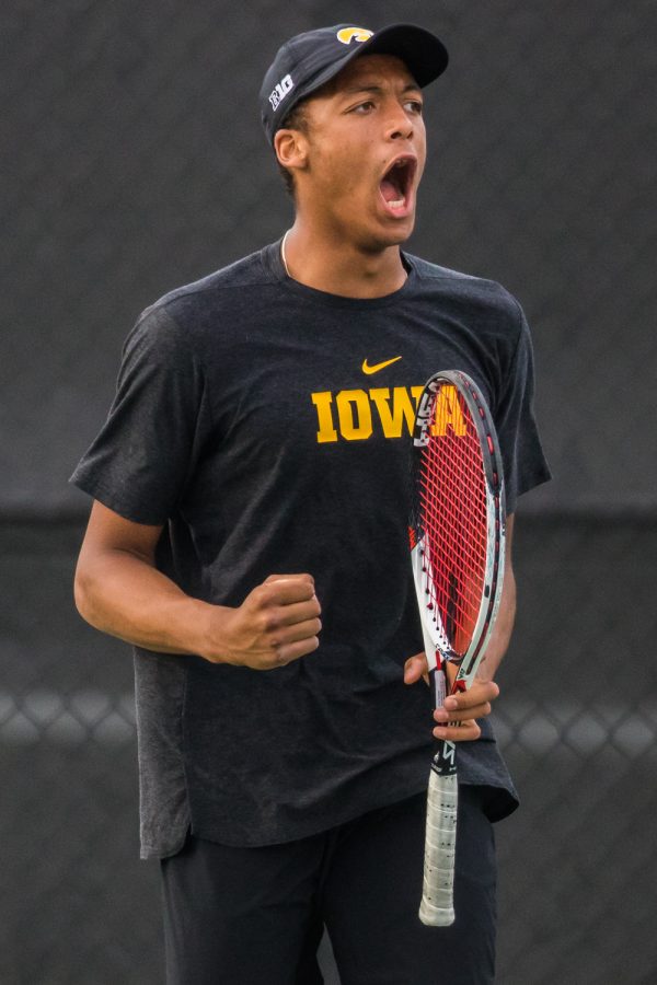 Iowa's Oliver Okonkwo celebrates a point during a men's tennis match between Iowa and Illinois State at the HTRC on Sunday, April 21, 2019. The Hawkeyes defeated the Redbirds, 6-1.