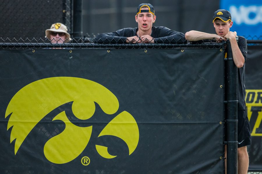 Iowa's Nikita Snezhko and Morgan Lohan support the singles players during a men's tennis match between Iowa and Illinois State at the HTRC on Sunday, April 21, 2019. The Hawkeyes defeated the Redbirds, 6-1.