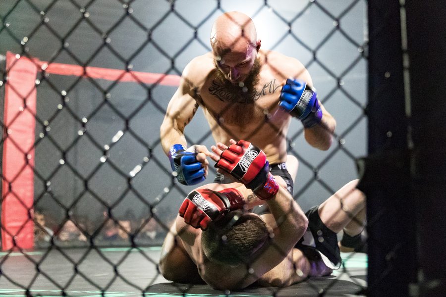 MMA fighter Ray Hedges rains blows upon Robert Chambers during Elite Fight League no. 4 at the Teamsters Union Hall in Cedar Rapids on Saturday, Apr. 13, 2019. Hedges won via TKO at 2:38 in the first round.