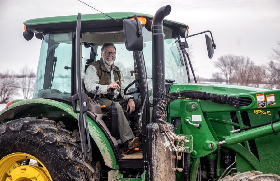 Bob Walker poses for a picture in his tractor while clearing the driveway to his farm on Friday, March 1. 