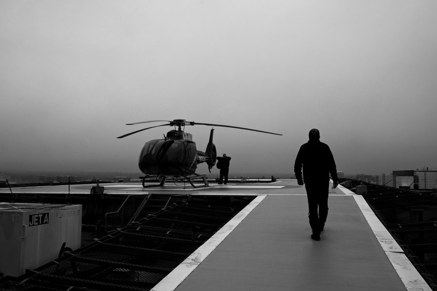 Lead pilot Tim Whaylen walks towards the helicopter on the roof of UIHC on March 20, 2019 in Iowa City, Iowa. 