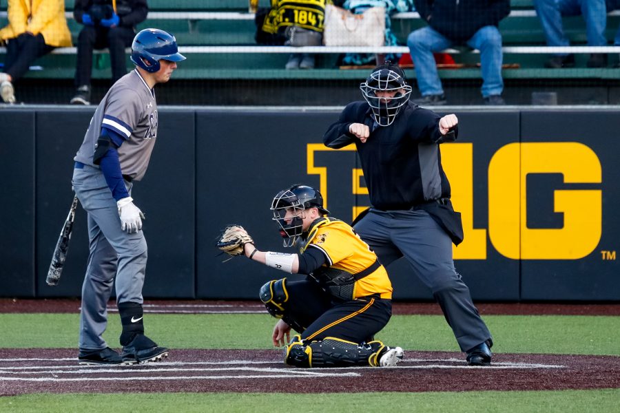 The home plate umpire signals the final out of a baseball game between the University of Iowa and Clarke University on Tuesday, Apr. 2, 2019. The Hawkeyes defeated the Pride 3-2. 