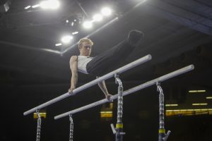 Nick Merryman gets ready to compete on the parallel bars during day two of the Big Ten Mens Gymnastics Championships in Carver-Hawkeye Arena on April 6, 2019. Gymnasts competed in individual competitions. Merryman placed 36th overall with a score of 13.600 on the parallel bars.