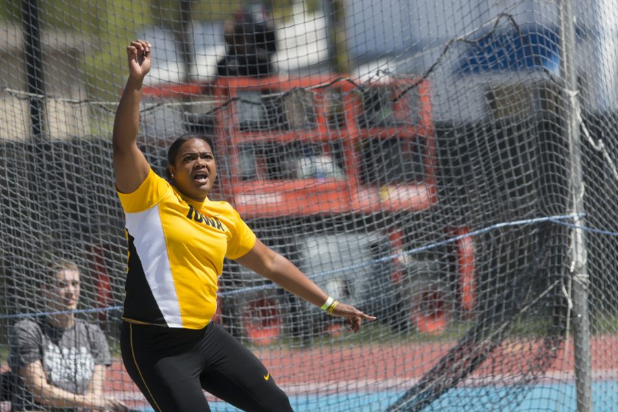 Iowas Laulauga Tausaga watches her throw during the 18th annual Musco Twilight at Francis X. Cretzmeyer Track on Saturday, April 22, 2017. Iowas men and womens track and field finished first overall in the Musco Twilight with a 237.5 and 203 respectively. 