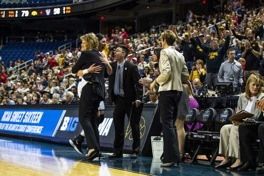 Iowa center Megan Gustafson hugs head coach Lisa Bluder after the win against NC State in the NCAA Sweet 16 game at the Greensboro Coliseum Complex on Saturday, March 30, 2019. The Hawkeyes defeated the Wolfpack 79-61.