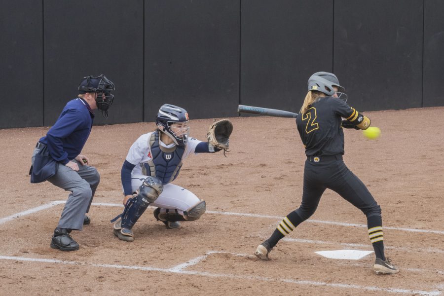 Iowa utility Aralee Bogar watches a pitch during the first game in a double header against Illinois on Saturday, April 13, 2019. Bogar got a walk to first. The Hawkeyes fell to the Illinis 12-11 but came back to win the second game. 