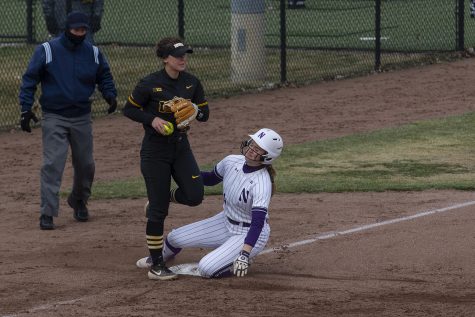 Pitcher/utility Mallory Kilian gets Maeve Nelson out on third during softball against Northwestern on Bob Pearl Field on March 30, 2019. The Wildcats defeated the Hawkeyes 6-2 after the 7th inning.(Katie Goodale/The Daily Iowan)