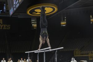 Stewart Brown competes on parallel bars on February 9, 2019 at Carver Hawkeye Arena vs. Oklahoma University. The Oklahoma Sooners won the meet with a total score of 405.150 over the Hawkeyes scoring 397.750.