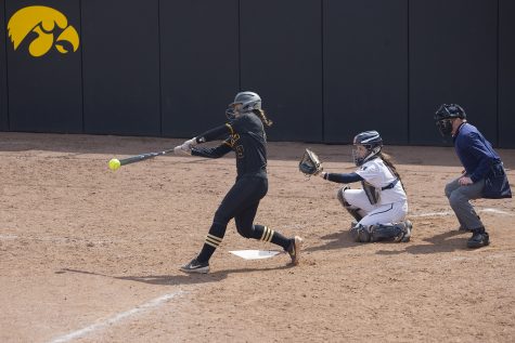 Iowa utility Abby Lien swings at a pitch during the the fourth inning of the first game in a double header against Illinois on Saturday, April 13, 2019. Lien popped up to right field. The Hawkeyes fell to the Illinis 12-11 but came back to win the second game.