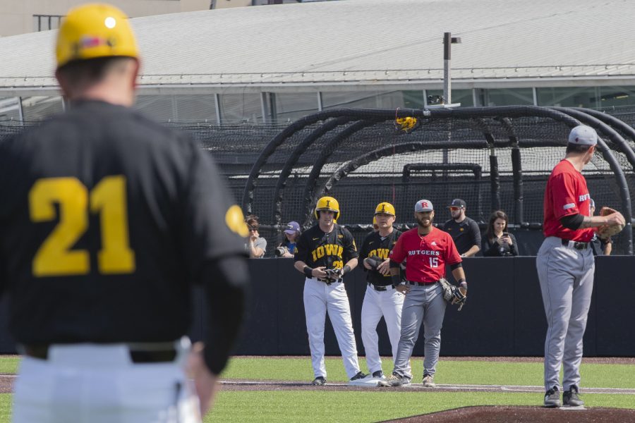 Iowa fielder Chris Whelan watches signs from Head Coach Rick Heller after hitting a single during the first inning of the afternoon Iowa vs Rutgers game at Duane Banks Field on Saturday, April 7, 2019. The Hawkeyes defeated the Scarlet Knights 9-5. 