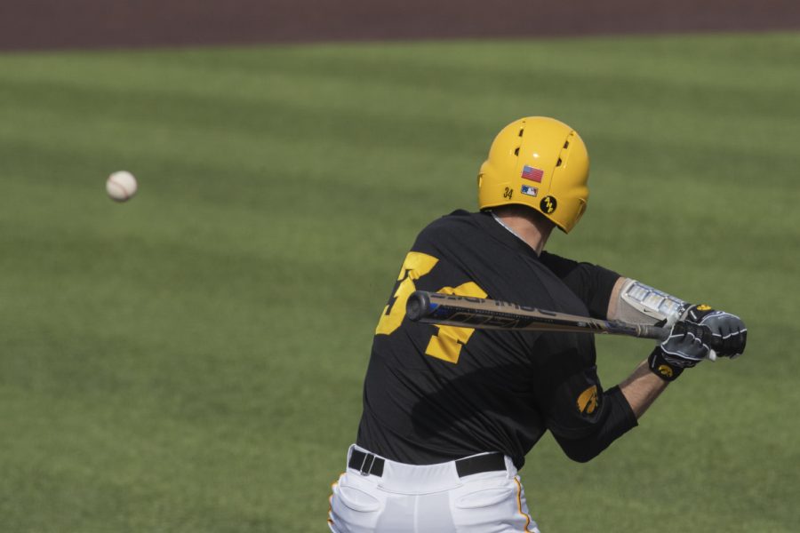 Iowa catcher Austin Martin gets ready to swing at a pitch during fifth inning of the afternoon Iowa vs Rutgers game at Duane Banks Field on Saturday, April 7, 2019. Martin flied out to left field. The Hawkeyes defeated the Scarlet Knights 9-5.