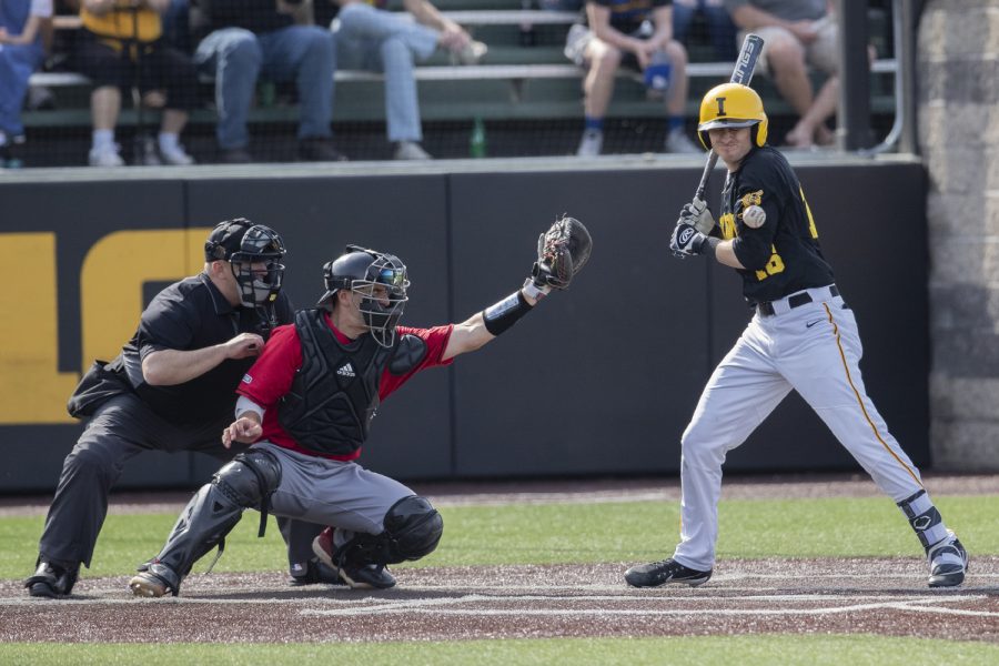 Iowa fielder Tanner Wetrich takes a ball to the arm during the afternoon Iowa vs Rutgers game at Duane Banks Field on Saturday, April 7, 2019. The Hawkeyes defeated the Scarlet Knights 9-5. 