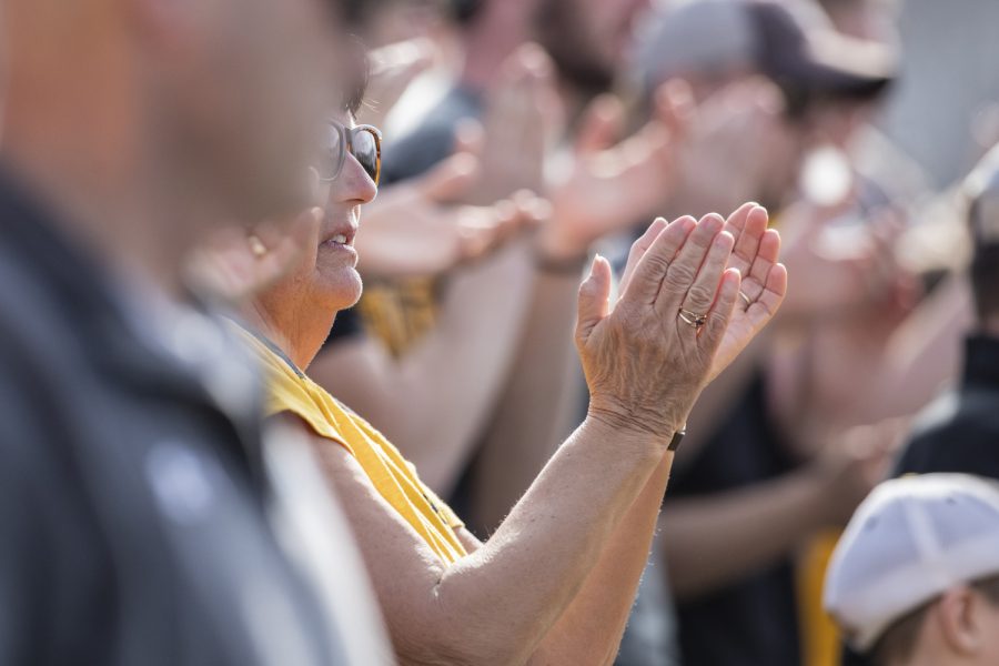 An Iowa fan claps during the afternoon Iowa vs Rutgers game at Duane Banks Field on Saturday, April 7, 2019. The Hawkeyes defeated the Scarlet Knights 9-5. 