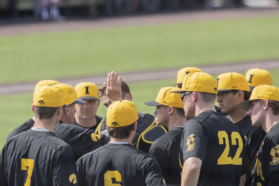 Iowa Head Coach Rick Heller talks to the team during the afternoon Iowa vs Rutgers game at Duane Banks Field on Saturday, April 7, 2019. The Hawkeyes defeated the Scarlet Knights 9-5. 