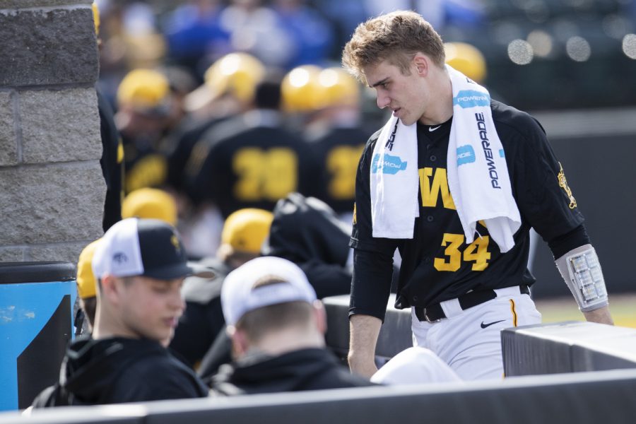 Iowa catcher Austin Martin walks to the cooler during the afternoon Iowa vs Rutgers game at Duane Banks Field on Saturday, April 7, 2019. The Hawkeyes defeated the Scarlet Knights 9-5. 